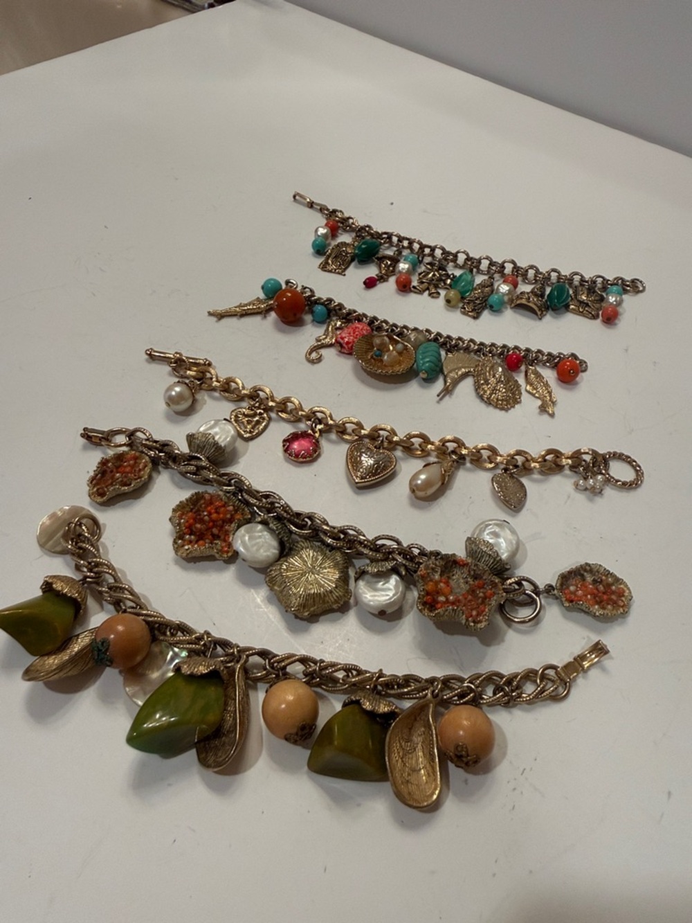 Gold-Tone Multi Charm Bracelet Set with Green and Coral Accents